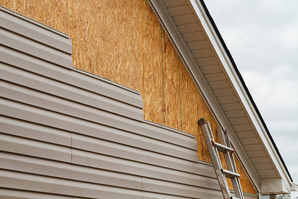 Professional Siding Contractor technician working in Sea Cliff, NY